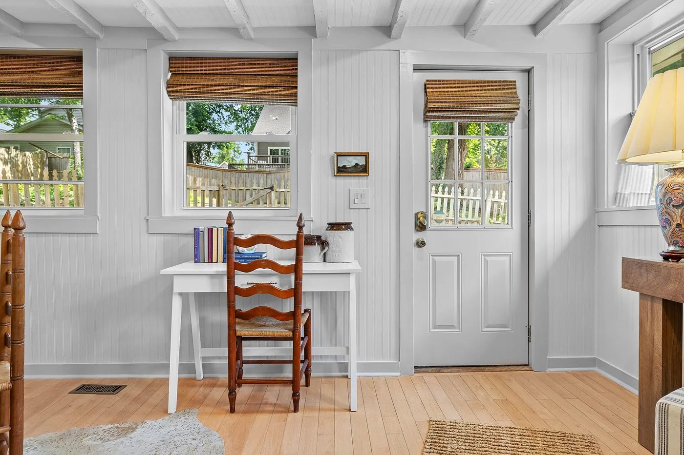 Entryway with fresh paint and hardwood flooring